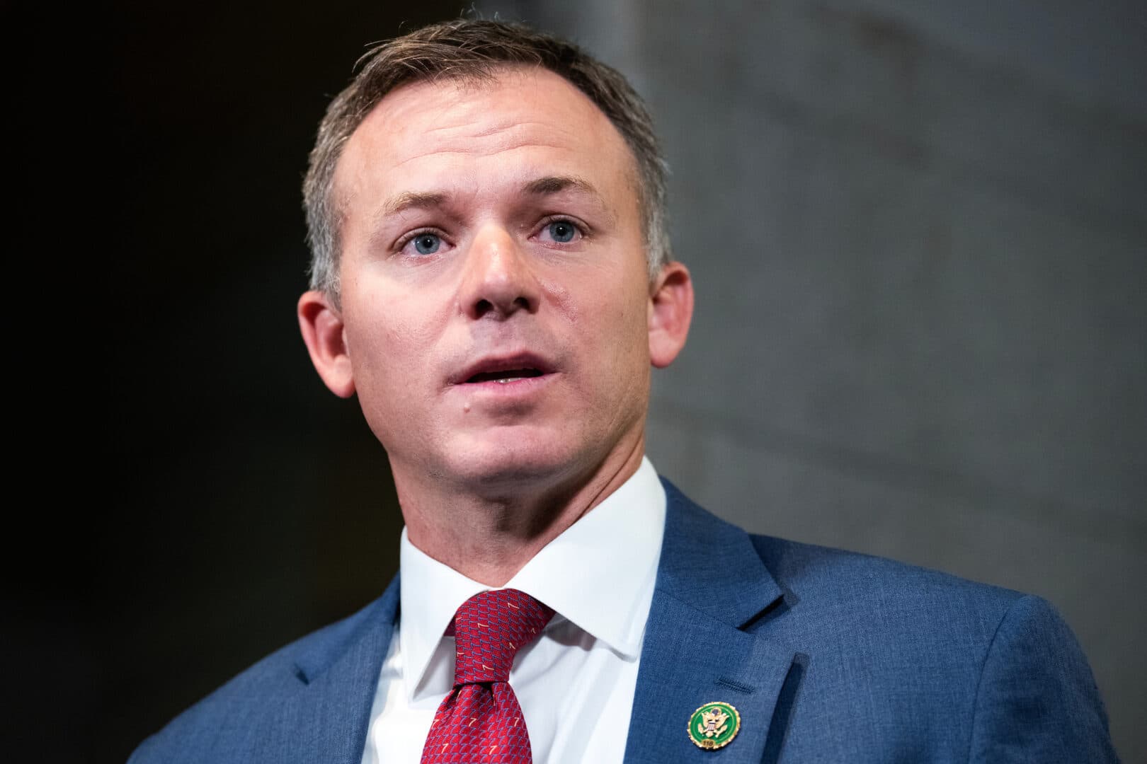 Official portrait of Utah Congressman Blake Moore in front of a neutral background.